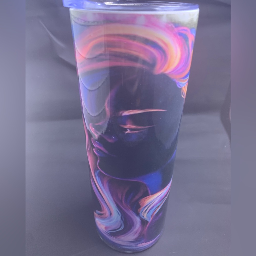 Neon woman kissing a dolphin.
